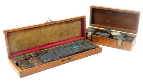 Two wooden boxes containing Victorian and later printer's illustrative blocks.