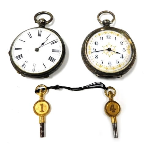 A late 20thC lady's silver cased pocket watch, open faced, key wind, circular enamel dial bearing Arabic numerals, the case with floral and foliate engraving, vacant shield reserve, with key, and a further silver pocket watch, with enamel dial bearing Rom