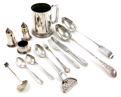 A group of plated wares, to include a Victorian basting spoon, the handle intricately decorated, a Fiddle pattern basting spoon, initial engraved, a James Dixon & Sons plated tankard, lemon squeezer, German flatware, etc. (a quantity)