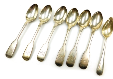 Six Victorian silver Old English pattern teaspoons, monogram engraved, London 1869, and a George V silver grapefruit spoon, Birmingham 1939, 6.06oz.