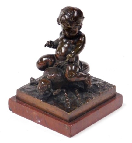 Auguste Moreau (French 1834-1917). A bronze sculpture of a putto riding a beetle, raised on a naturalistic square base, above a porphyry marble base, signed, 8.5cm wide.