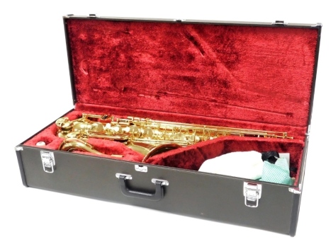 A Yamaha brass saxophone, model YTS-25, serial number 019213, cased, and a Hercules saxophone stand.