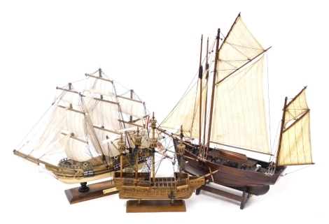 A Nauticalia wooden scale model of the Mary Rose, 33cm wide, model of the Endeavour 1762, 48cm wide, and a further sailing vessel, possibly a Thames barge, on a cradle stand, 52cm wide. (3)