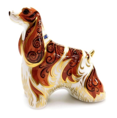 A Royal Crown Derby porcelain American Spaniel paperweight, gold stopper and red printed marks, 11cm high, boxed.