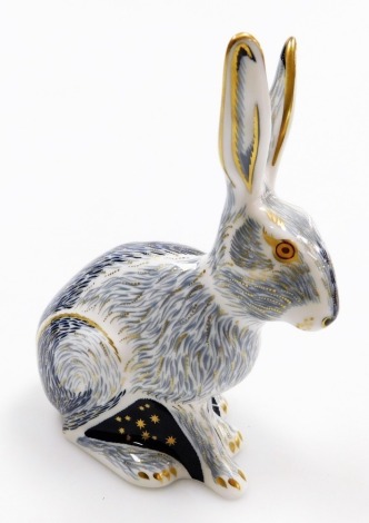 A Royal Crown Derby porcelain Starlight Hare paperweight, an exclusive for the Royal Crown Derby Collector's Guild, gold stopper and red printed marks, 13cm high, boxed.