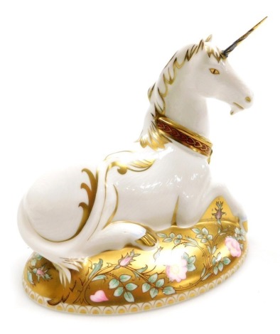 A Royal Crown Derby porcelain Mythical Unicorn paperweight, second of a pair of Mythical Beasts, exclusive to Govier's of Sidmouth, limited edition number 118/1750, gold stopper and red printed marks, 14cm high, boxed.