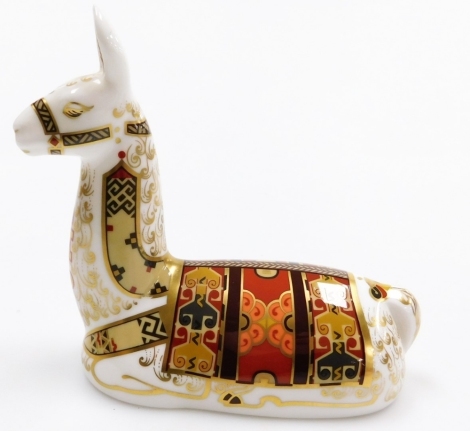 A Royal Crown Derby porcelain Llama paperweight, an exclusive for the Royal Crown Derby Collector's Guild, gold stopper and red printed marks, 13cm high, boxed.