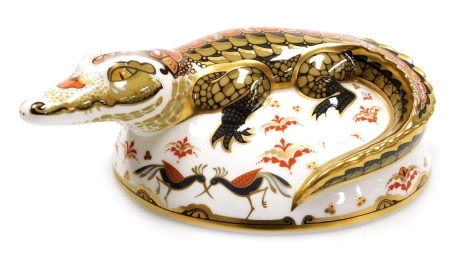 A Royal Crown Derby porcelain Crocodile paperweight, gold stopper and red printed marks, 17cm wide, boxed.