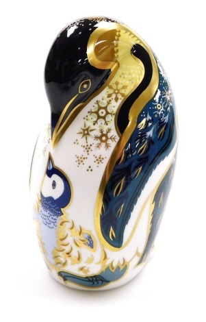 A Royal Crown Derby porcelain Penguin and Chick paperweight, gold stopper and red printed marks, signed to underside 13cm high, boxed.