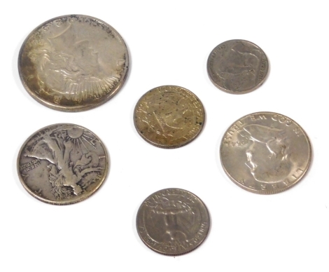 A US silver Liberty dollar 1925, half dollar 1941 and 1954, quarter dollars 1961 and 65, and five cents 1936.