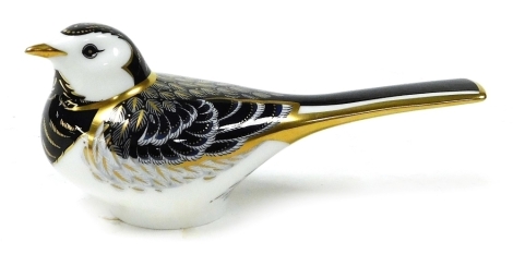 A Royal Crown Derby paperweight modelled as a pied wagtail, boxed.