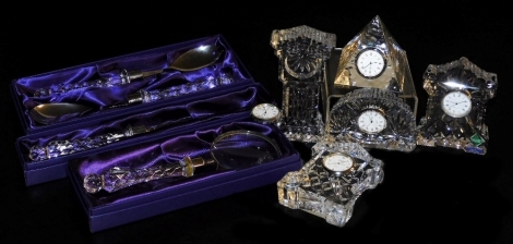 Five Edinburgh Crystal mantel clocks, together with a magnifying glass, cake knife and salad servers. (8)