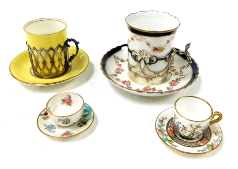 A late 19thC Coalport porcelain demi tasse coffee can and saucer, with silver holder, a further canary yellow coffee can and saucer with silver cup holder, Coalport Indian Tree Pattern miniature teacup and saucer and a Crown Staffordshire miniature teacup