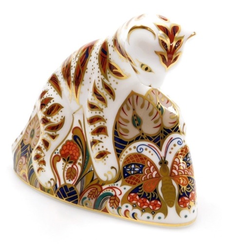 A Royal Crown Derby imari paperweight modelled as a Bengal tiger cub.