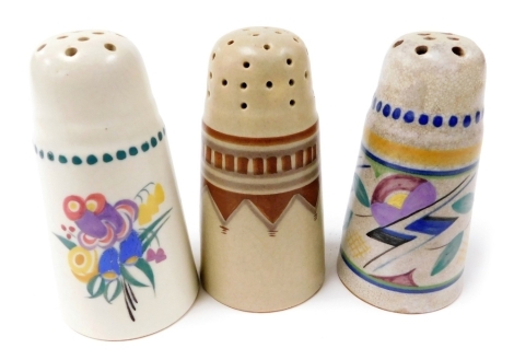 Three Poole pottery flower sifters, one traditionally painted with flowers, another with geometric flowers, the third with geometric banding, impressed marks, 12cm high.