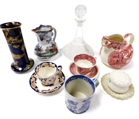 A group of Masons ironstone, including a Vista pattern jug, blue lustre vase decorated with a peacock, together with a Belleek porcelain saucer and a Shamrock pattern dressing table box and cover, and a pressed glass decanter and stopper.