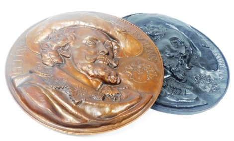A pair of early 20thC tin wall plaques, cast in high relief with a profile of Peter Paul Reubens, with coat of arms, one with a bronze effect finish, the other with a copper effect finish, 59cm wide.