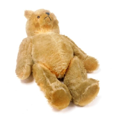 A mid 20thC growler teddy bear, 65cm high.