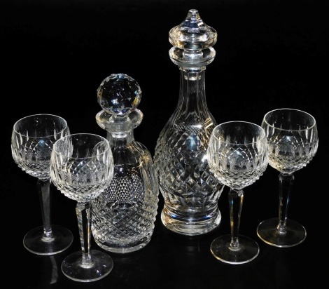 Two Waterford Colleen pattern crystal decanters, one of baluster form with a mushroom shaped stopper, 33cm high, the other of ovoid form with a faceted stopper, 26cm high, together with four stemmed wine glasses. (6)