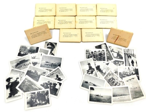 A set of World War II German cigarette cards, the Second World War in Pictures, series 1-60, by Eilebrecht Erzeugnisse viele rauchen, in card packets.