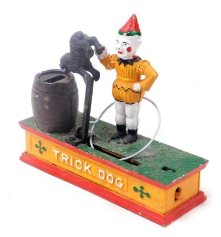 A replica cast iron trick dog money box, 21.5cm wide.