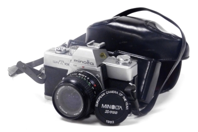 A Minolta SRT101 camera, with a 28mm 1:35 lens, and a 72mm skylight lens.