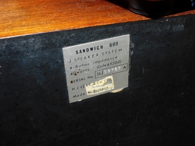 A Pro-Ject 9 record player, with instructions, together with a pair of Leak Sandwich 600 speakers, serial number 3L/19569A. (3) - 3