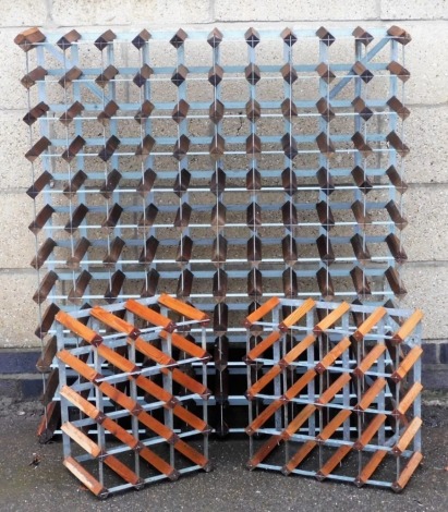 A wooden and metal one hundred and twenty bottle wine rack, 111cm high, 101cm wide, and two further wine racks to contain twenty and fifteen bottles. (3)