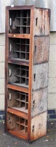 A rustic pine wine rack of rectangular form, created from five vintage bottle crates, 161cm x 43cm.