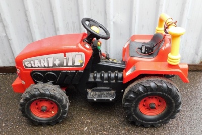 A Giant + III red electric child's ride on tractor.