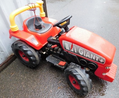 A Giant + III red electric child's ride on tractor. - 2