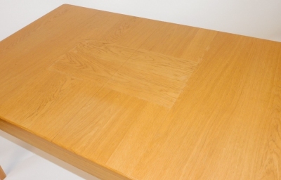 A light oak draw leaf dining table, raised on tapering square legs, 77cm high, 145cm wide, 195cm extended, 90cm deep. - 2