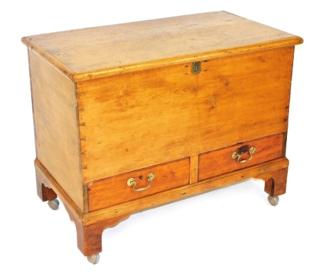 A 19thC pine mule chest, with cast iron hinges, having two frieze drawers, raised on bracket feet, later raised on castors, 70cm high, 89cm wide, 49cm deep.