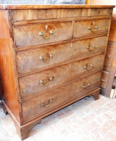 A George III mahogany chest of drawers, with a secret frieze drawer above two short over three long drawers, each with brass drop handles, raised on bracket feet, 121cm high, 119cm wide, (AF).