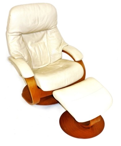 A Stressless cream leather armchair, with matching footstool.