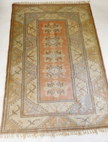 A Turkish pastel Oushak rug, decorated with five central geometric and floral medallions, within repeating geometric and floral borders, 286cm x 195cm.