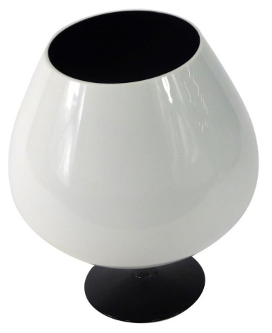 A 1960s art glass goblet, on a white finish with blackened inside and stepped foot, 23cm high.