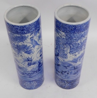 A pair of Japanese blue and white stick stands, each with a bird of prey and floral spray design, unmarked, each 77cm high, 26cm diameter. - 2