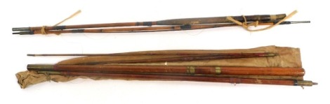 Two split cane fishing rods, together with a canvas carry bag. (3)