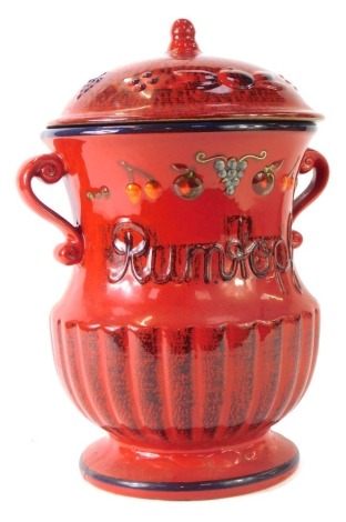 A German Rumtopf storage jar, decorated with berries, 30cm high.