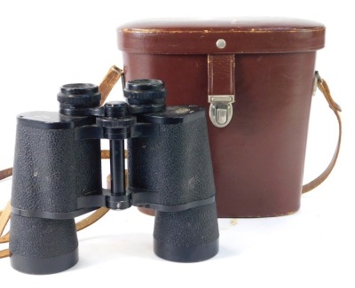 A set of Carl Zeiss Jena binoculars, 10x50w labelled DDR in brown leather travel case.