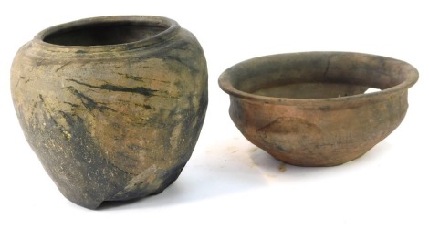 Two Roman pottery bowls, comprising a third century vase from Upchurch Marshes Kent, and a third century lobed bowl from the same location, 16cm and 9cm high. (2, AF)