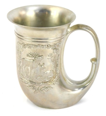 A Western Germany BMF pewter tankard, of horn shape and cast with panel of deers, 12.5cm high.