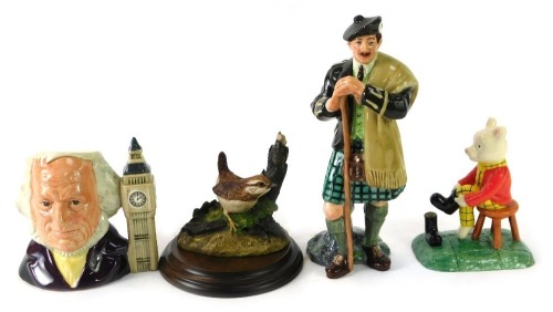 A group of ornaments, comprising a Country Artists wren figure group, boxed, a Royal Doulton Out For The Day Rupert characters figure, boxed, a Royal Doulton John Doulton small character jug, and a Royal Doulton The Lead Figure, boxed. (4)