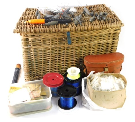 A wicker fishing seat, various nylon rods, weights and accessories, and a cased set of binoculars. (a quantity)