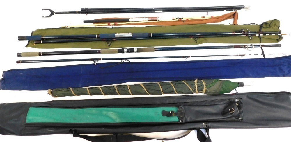 A group of fishing rods, comprising a Daiwa Moonraker Fast Tip 12 fly rod,  split cane fishing rod, weights, etc. All enclosed in a black rod bag.