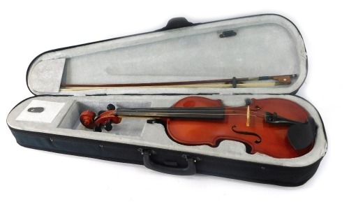 A Windsor two piece back violin, bearing Windsor label, and bow, in a material carry case, 57cm long.