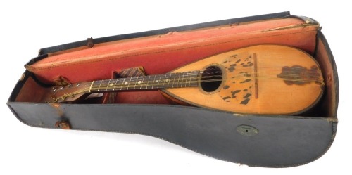 A mandolin, striped ebony casing with bone tuning keys, and tortoiseshell applied crest, in material travel case, 61cm high.