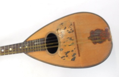 A mandolin, striped ebony casing with bone tuning keys, and tortoiseshell applied crest, in material travel case, 61cm high. - 2