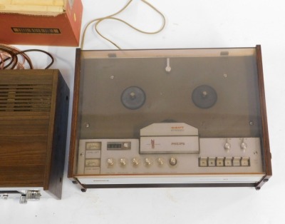 A Sony FM Stereo FM/AM receiver STR7015, a Philips Stereo four track, various tapes and two speakers. - 2